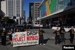 Local activists and tech workers protest Google and Amazon's Project Nimbus contract with the Israeli military and government outside the Google Cloud Next conference on August 29, 2023 in San Francisco, California.