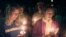 FILE — Students appear at a vigil against violence at Prexy's Pasture on the University of Wyoming campus in Laramie, Wyoming, Oct. 10, 1999, about a year after the death of Matthew Shepard, a gay student who was tied to a fence post, tortured, and left to die. 