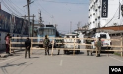 Security forces dug holes on the roads and placed wooden rafters in them to erect barricades, March 7, 2024. No one was allowed to enter or leave the confined zone ahead of Prime Minister Narendra Modi's departure from the venue. (Wasim Nabi for VOA)