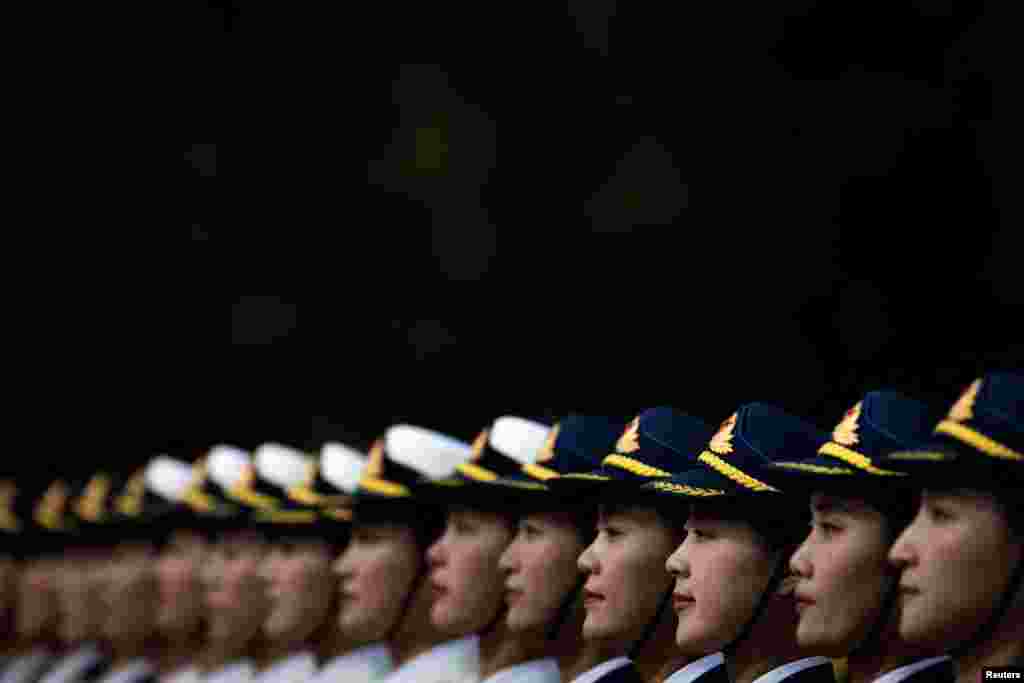 Female soldiers of the honor guard stand in formation during a welcoming ceremony for Democratic Republic of Congo's President Felix Tshisekedi at the Great Hall of the People in Beijing, China.