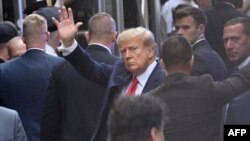 Former President Donald Trump arrives ahead of his arraignment at Manhattan Federal Court in New York, April 4, 2023. 