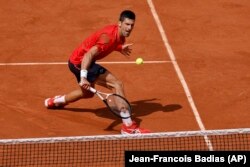 Serbia's Novak Djokovic plays a shot against Norway's Casper Ruud during their final match of the French Open tennis tournament at the Roland Garros stadium in Paris, Sunday, June 11, 2023. (AP Photo/Jean-Francois Badias)