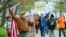 FILE - Opponents of a bill to repeal Connecticut's religious exemption for required school vaccinations march down Capitol Avenue before the State Senate voted on legislation on April 27, 2021, in Hartford, Conn. 