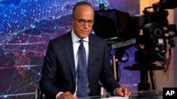 FILE - NBC Nightly News and Dateline anchor Lester Holt poses for photos on the Nightly News set, at NBC headquarters, in New York, July 31, 2019.