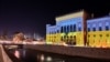 This picture shows the Sarajevo city hall lit up with the colors of the Ukrainian flag, late on Feb. 24, 2022. 