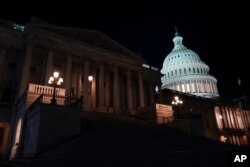 Lights illuminate the U.S. Capitol after House Speaker Kevin McCarthy announced that he and President Joe Biden had reached an "agreement in principle" to resolve the looming debt crisis on May 27, 2023, in Washington.