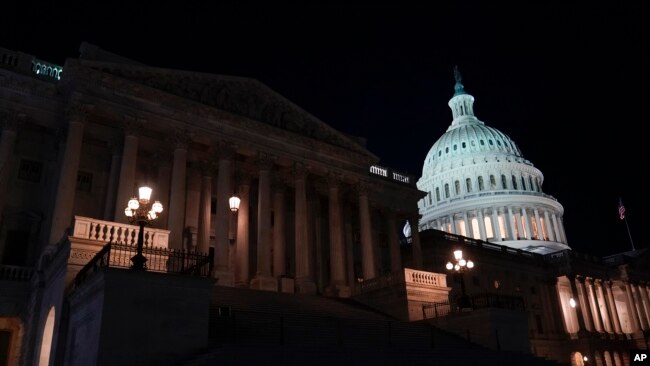 Lights illuminate the U.S. Capitol after House Speaker Kevin McCarthy announced that he and President Joe Biden had reached an