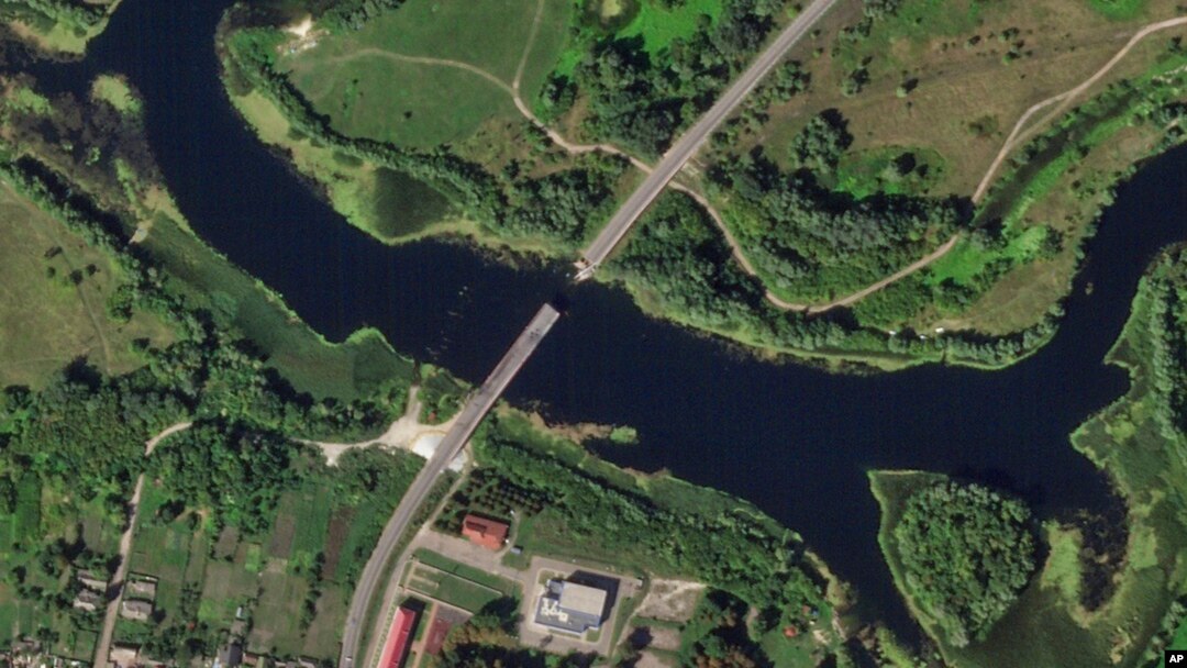 This satellite photo from Planet Labs PBC shows a destroyed bridge across the Seym River at the town of Glushkovo in Russia's Kursk region, Aug. 17, 2024. 
