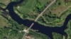 This satellite photo from Planet Labs PBC shows a destroyed bridge across the Seim River at the town of Glushkovo in Russia's Kursk region, Aug. 17, 2024. 