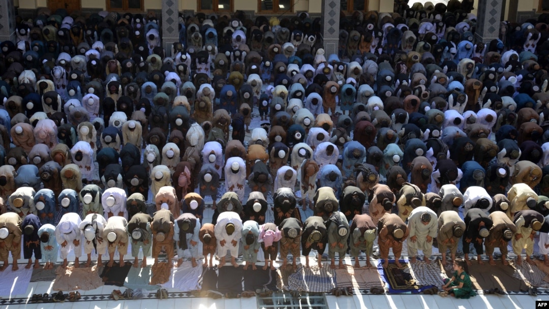 Muslim devotees offer Eid al-Adha prayers at Hazrat-e- Omar mosque in Kandahar, Afghanistan, June 17, 2024. 