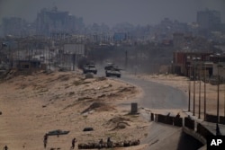 Israeli army tanks are seen in the central Gaza Strip, May 18, 2024.