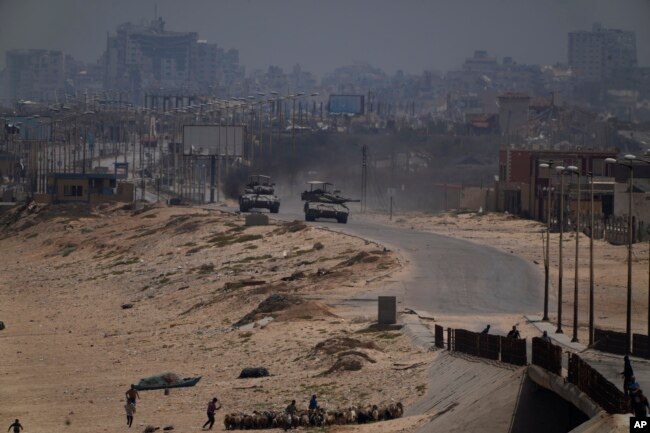 Israeli army tanks are seen in the central Gaza Strip, May 18, 2024.