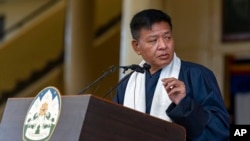 FILE - Penpa Tsering, head of the Central Tibetan Administration, addresses a gathering to mark the anniversary of the 1959 Lhasa uprising, in Dharmsala, India, March 10, 2022. 