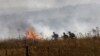 Israeli firefighters put out flames in a field after rockets launched from southern Lebanon landed on the outskirts of Katzrin in the Israel-annexed Golan Heights on June 2, 2024. 