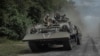 FILE - Ukrainian soldiers ride a military vehicle near the Russian border in Ukraine's Sumy region, on Aug. 10, 2024.