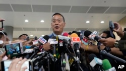 Thailand's Prime Minister Srettha Thavisin talks to reporters on his arrival at Parliament in Bangkok, Thailand, Monday, Sept. 11, 2023.