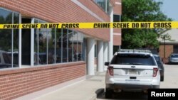 A police cruiser sits outside Representative Gerry Connolly's district office after a person wielding a baseball bat attacked two of his staff members, sending them to the hospital with non-life threatening injuries in Fairfax, Va., May 15, 2023. 