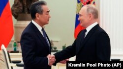 俄罗斯总统普京在克里姆林宫会晤到访的中共中央政治局委员、中央外事办公室主任王毅。（2023年2月22日）