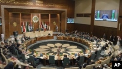 In this photo released by Egypt's Ministry of Foreign Affairs, delegates and foreign ministers of member states convene at the Arab League headquarters in Cairo, Egypt, May 7, 2023.