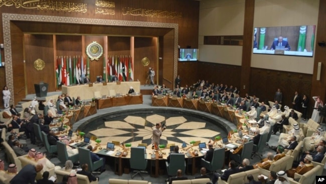 In this photo released by Egypt's Ministry of Foreign Affairs, delegates and foreign ministers of member states convene at the Arab League headquarters in Cairo, Egypt, May 7, 2023.