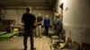 U.S. Secretary of State Antony Blinken visits a basement reportedly used to hold people captive as he tours the Yahidne School, which is being turned into a museum, in Yahidne, Sept. 7, 2023. 