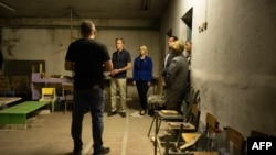 U.S. Secretary of State Antony Blinken visits a basement reportedly used to hold people captive as he tours the Yahidne School, which is being turned into a museum, in Yahidne, Sept. 7, 2023. 