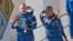 NASA astronauts Butch Wilmore, left, and Suni Williams wave as they leave the operations and checkout building for a trip to launch pad at Space Launch Complex 41 June 1, 2024, in Cape Canaveral, Fla. 