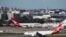 Pesawat dari maskapai Qantas terlihat berada di Bandara Internasional Kingsford Smith di Sydney, Australia, pada 18 Maret 2020. (Foto: Reuters/Loren Elliot)