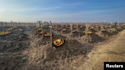 FILE - Graves of Russian Wagner mercenary group fighters are seen in a cemetery near the village of Bakinskaya in Krasnodar region, Russia, Jan. 22, 2023. 