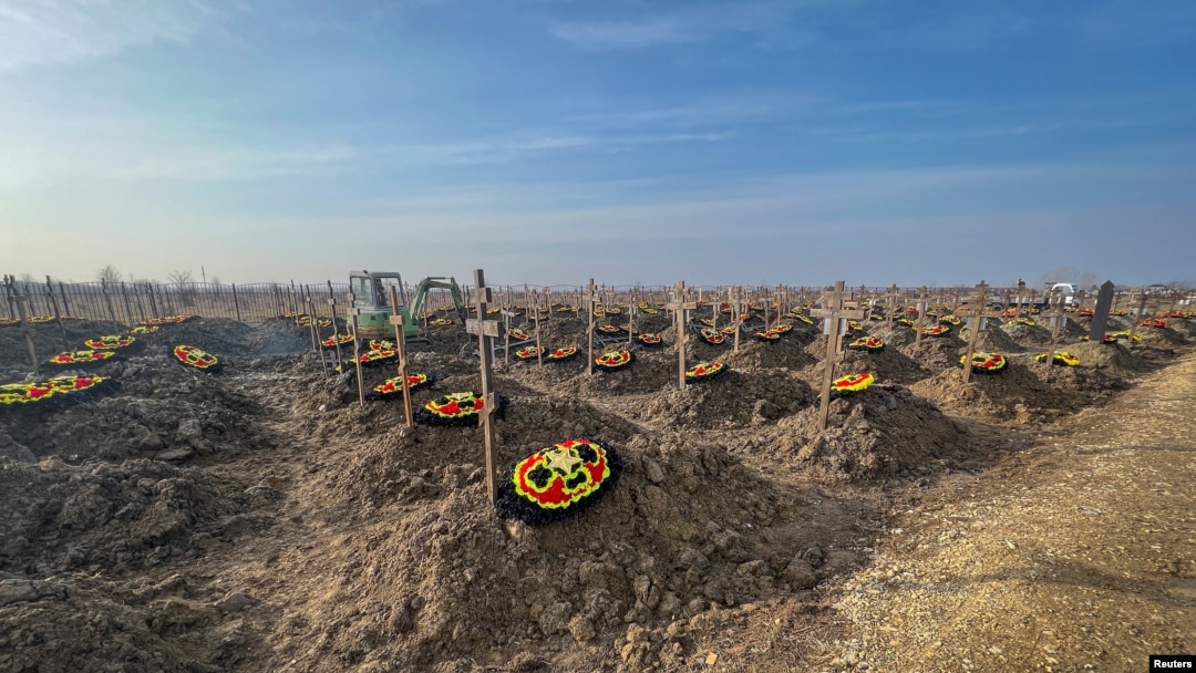 FILE - Graves of Russian Wagner mercenary group fighters are seen in a cemetery near the village of Bakinskaya in Krasnodar region, Russia, Jan. 22, 2023. 