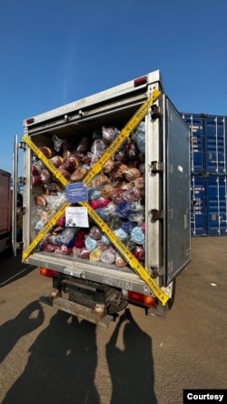 Cargo vehicles filled with thousands of textiles seized by the Trade Ministry. (Courtesy: Devianti Faridz)