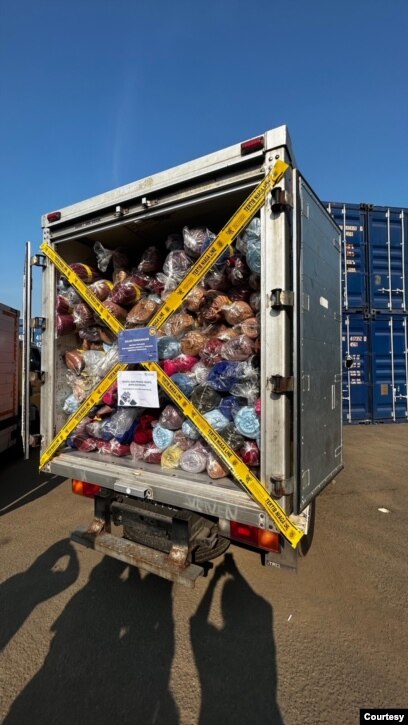 Cargo vehicles filled with thousands of textiles seized by the Trade Ministry. (Courtesy: Devianti Faridz)