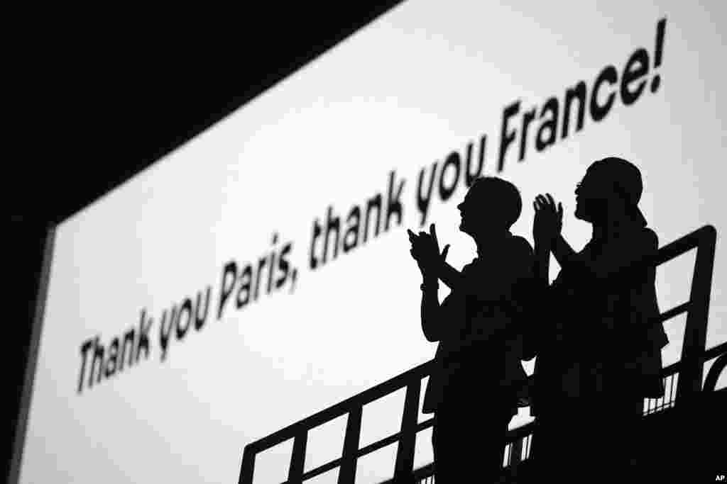 Spectators applaud during the 2024 Summer Olympics closing ceremony at the Stade de France, in Saint-Denis, France, Aug. 11, 2024.