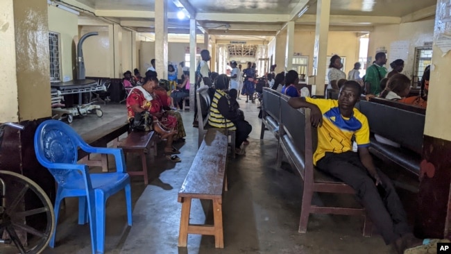 Patients sit in the waiting room of Mbingo Baptist Hospital in Mutengene, Cameroon, Tuesday May 21, 2024. (AP Photo/Angel Ngwe)