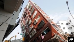 Debris surrounds a Hualien, Taiwan, building that collapsed during an earthquake the day before, April 4, 2024. Though Taiwan is no stranger to earthquakes, their toll on the island has been relatively contained because the community has prepared for them, say experts.