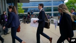 Representatives of Fox News arrive at the justice center for the Dominion Voting Systems' defamation lawsuit against Fox News, Tuesday, April 18, 2023, in Wilmington, Del.
