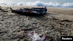 FILE - A piece of the boat and clothing from a deadly migrant shipwreck are seen in Steccato di Cutro near Crotone, Italy, Feb. 28, 2023. The United Nations' migration agency reported that last year was the deadliest for migrants in the MENA since 2017.