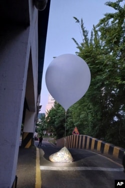 This photo provided by Incheon Fire Headquarters shows balloons with trash presumably sent by North Korea, in Incheon, South Korea, June 2, 2024.