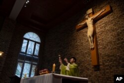 Hong Jeong Su, priest of the Saint Mary's Catholic Church, leads a mass in Ulaanbaatar, Mongolia, Aug. 30, 2023.