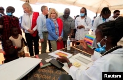US first lady Jill Biden meets health workers at a nutrition outpost within the drought response site during a visit to highlight the impacts of drought relief, at the Lositeti village in Matapato North, Kajiado County, Kenya, Feb. 26, 2023.