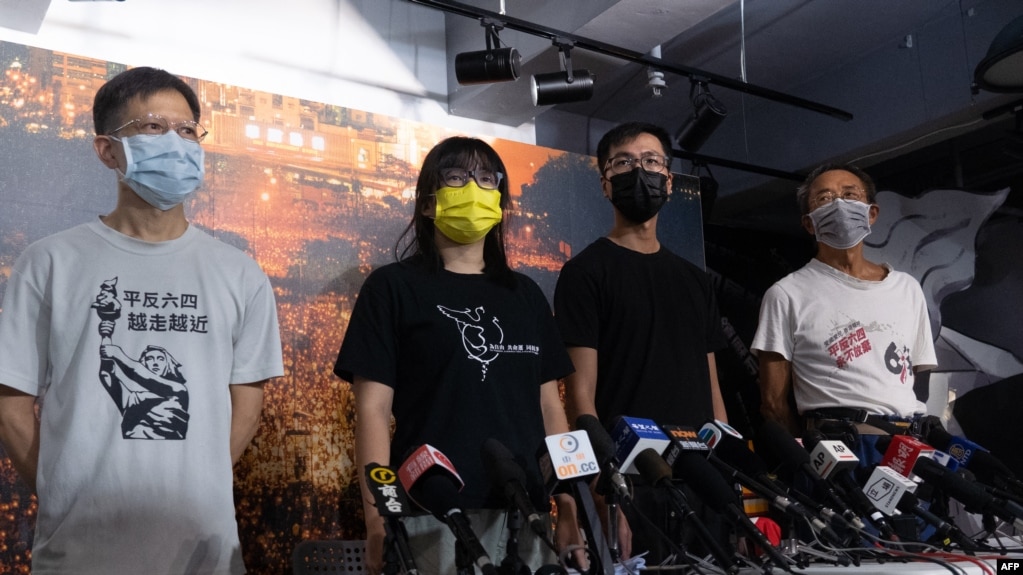 FILE - The Hong Kong Alliance in Support of Patriotic Democratic Movements of China standing committee members, from left, Tang Ngok Kwan, Chow Hang-tung, Simon Leung Kam-wai and Tsui Hon Kwong attend a press conference in Hong Kong on Sept. 5, 2021.