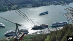 FILE - Cruise ships are shown near downtown Juneau on June 7, 2023, along the Gastineau Channel, in Alaska.