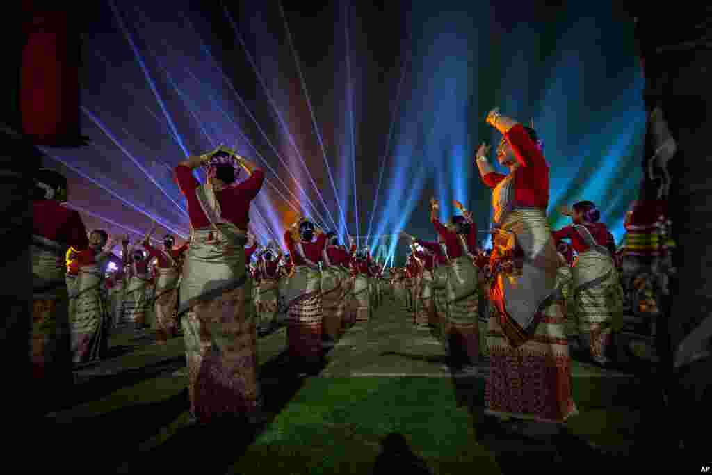 Around 11,000 Bihu dancers and musicians perform together in an attempt to set a new Guinness World Record in the largest folk dance performance category, in Guwahati, India.