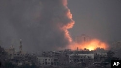 Smoke rises following an Israeli airstrike in the Gaza Strip, as seen from southern Israel, Oct. 14, 2023.