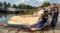 This photo provided by BRFK Facebook shows a damaged boat at the northern edge of Budapest where it was towed, after being discovered in the water by police following a boat collision on the Danube River, in Hungary, May 19, 2024. 