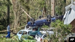 Cars are destroyed after floods caused by a deadly cyclone in Mucum, Rio Grande do Sul state, Brazil, Sept. 6, 2023. 