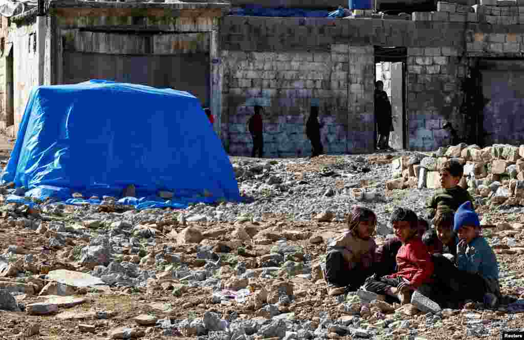 Displaced Syrians children sit at a temporary accommodation center for people affected by a devastating earthquake in Gaziantep, Turkey.