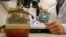 A jar containing saffron preserved in water that was retrieved from the wreck of a 15th century Danish warship, the Gribshunden, after more than 500 years on the seabed, sits in a laboratory in Lund University, Denmark, March 2, 2023. 