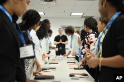 Dr. Adam Friedman teaches procedures like biopsies and sutures during a hands-on bioskills workshop offered in collaboration with Nth Dimensions at the George Washington University Student Center in Washington on July 14, 2023. (Joshua Lee Reed/AAD via AP)