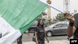 A praying group walks in Lagos on February 18, 2023, ahead of the Nigerian presidential election scheduled for February 25, 2023.